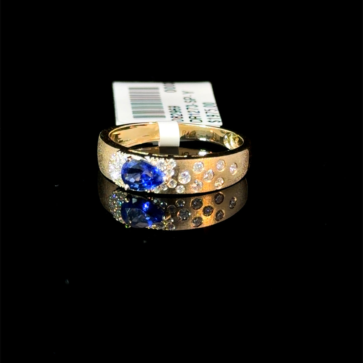 0.74ct Pear Sapphire & Scattered Diamond Band