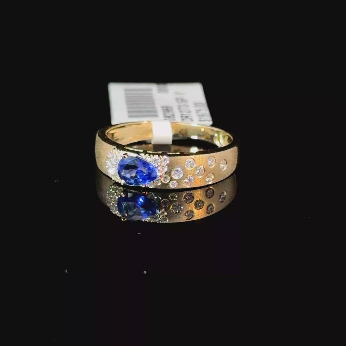 0.74ct Pear Sapphire & Scattered Diamond Band